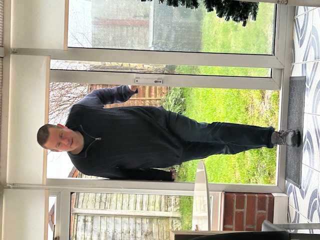 Photo of Martin Rigby opening the door.