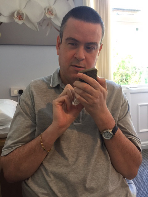Photo of Martin Rigby using his mobile phone.